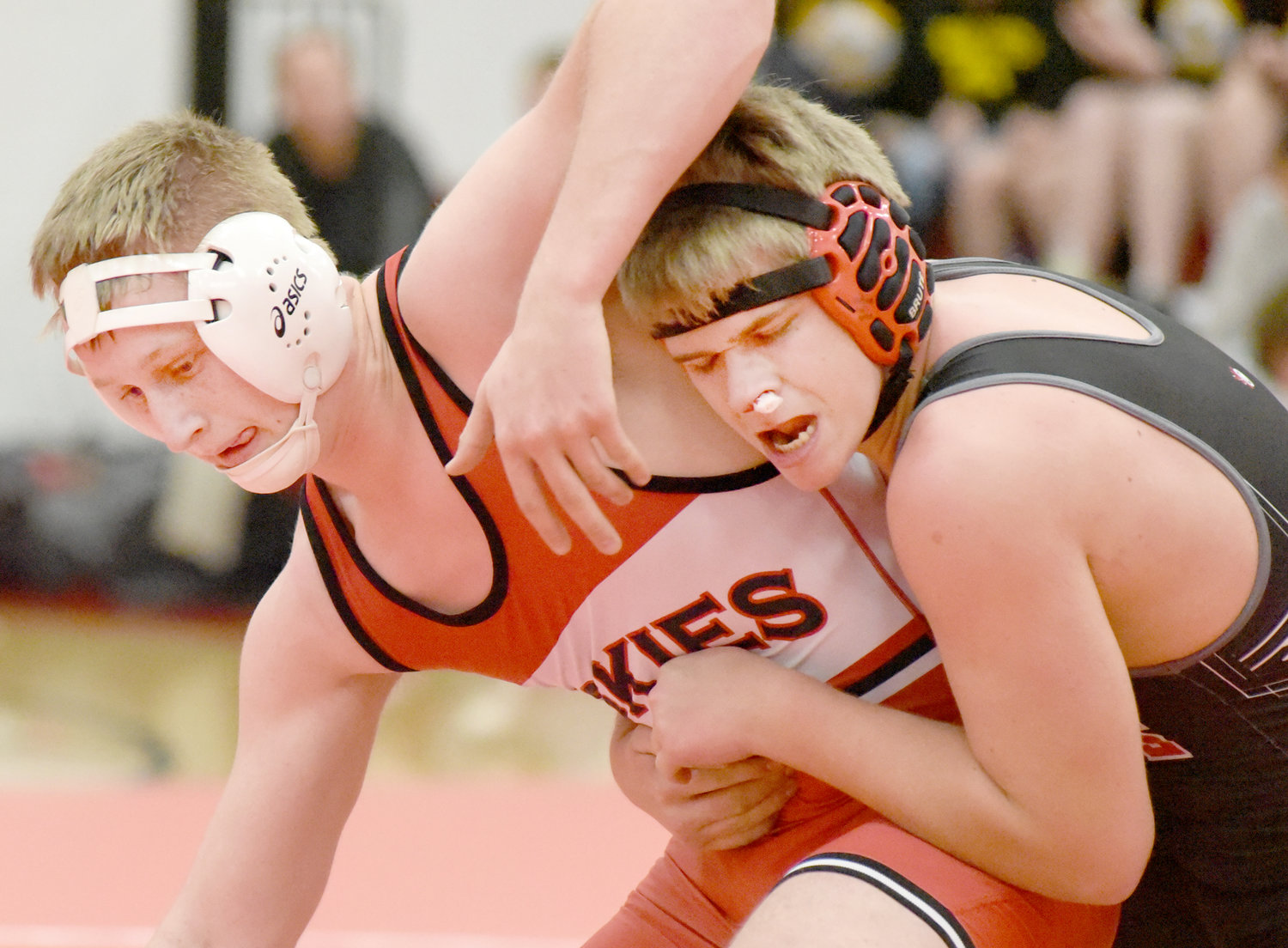Highland’s Cael Yeggy escapes from Cardinal Community’s Donovan Babcock on his way to pinning Babcock.